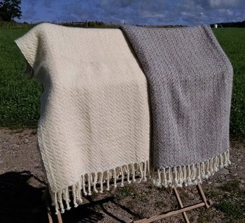 white and gray Cotswold blankets